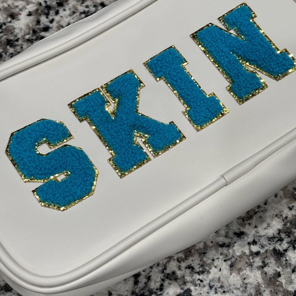 White Pouch with Blue and Gold 'SKIN' Design - Picture 9 of 9